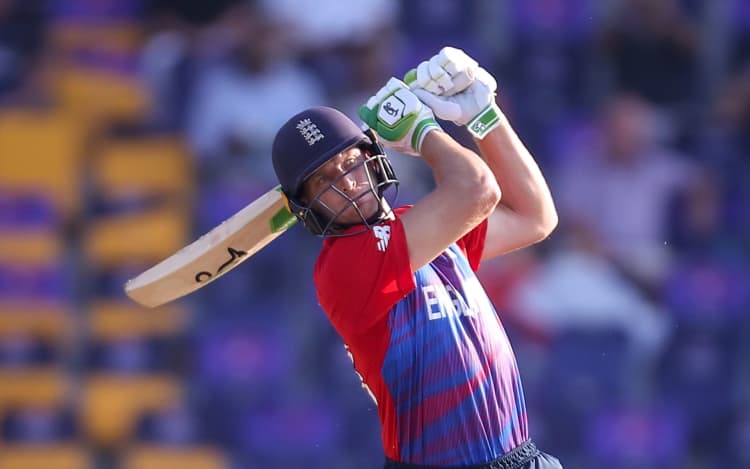 England's Jos Buttler hits a six.